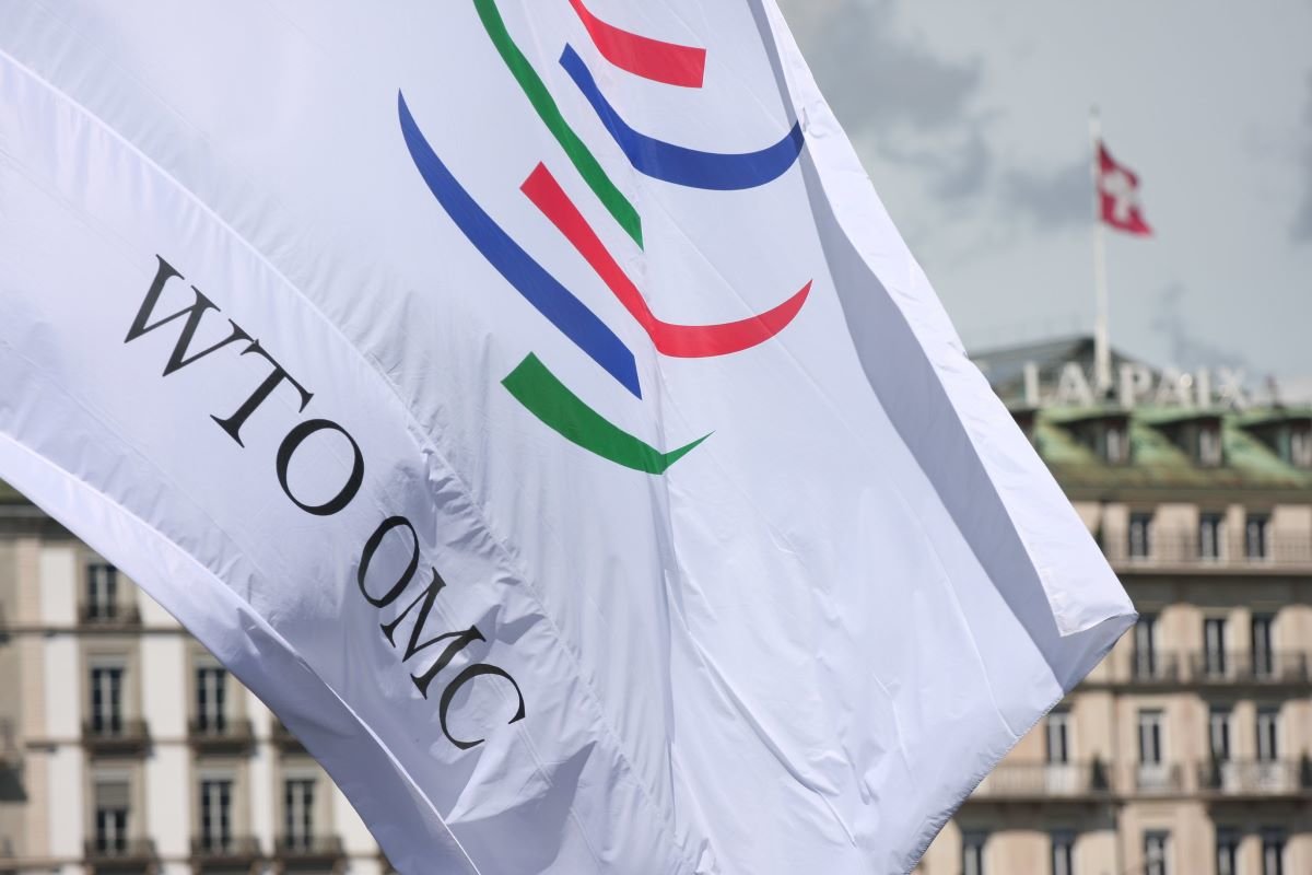 WTO OMC flag at the WTO Public Forum 2010. Photo via World Trade Organisation on Flickr.