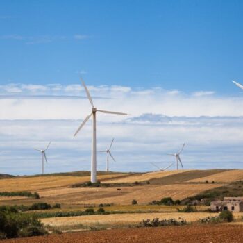 White windmills under blue sky in Tunisia