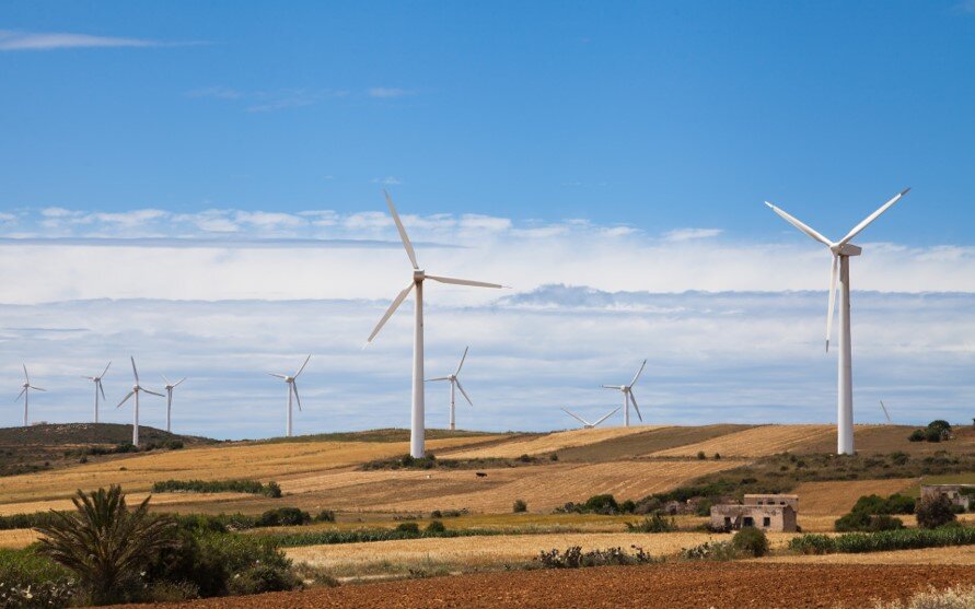 White windmills under blue sky in Tunisia