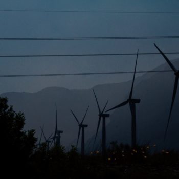 Wind turbines and electricity lines at night