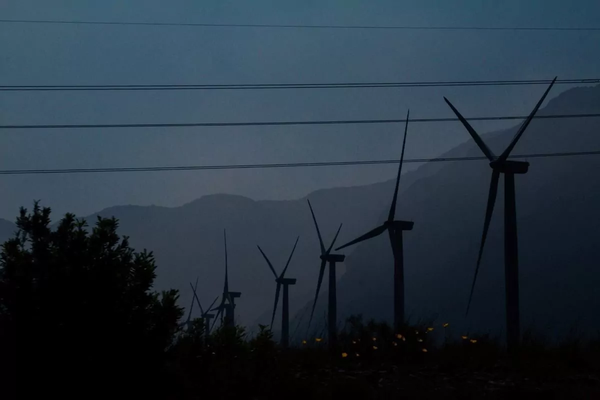 Wind turbines and electricity lines at night