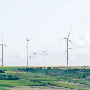 Wind turbines in a green field, Mölsheim, Germany.