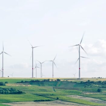 Wind turbines in a green field, Mölsheim, Germany.