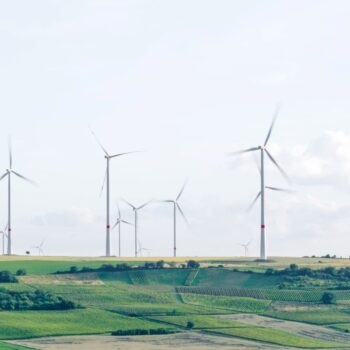 Wind turbines in a green field, Mölsheim, Germany.