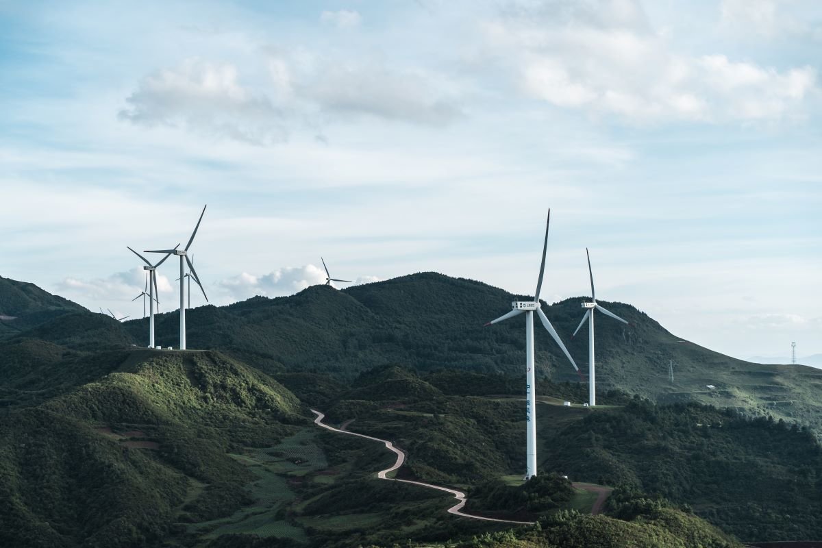 Wind turbines on Fuxian Lake. Photo by Luo Lei on Unsplash