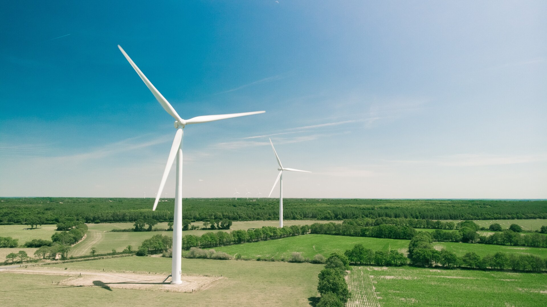 Windmills in France. Following 7 European countries withdrawing from the Energy Charter Treaty, the international investment regime needs an overhaul. Photo by Tomas Reaubourg on Unsplash.