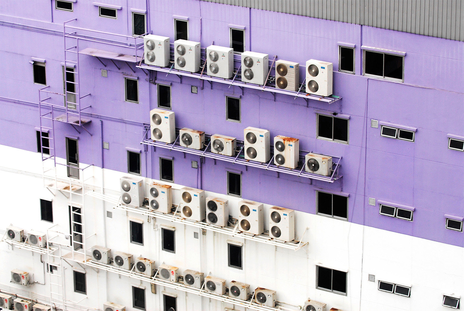 air conditioners on a building in bangkok, thailand
