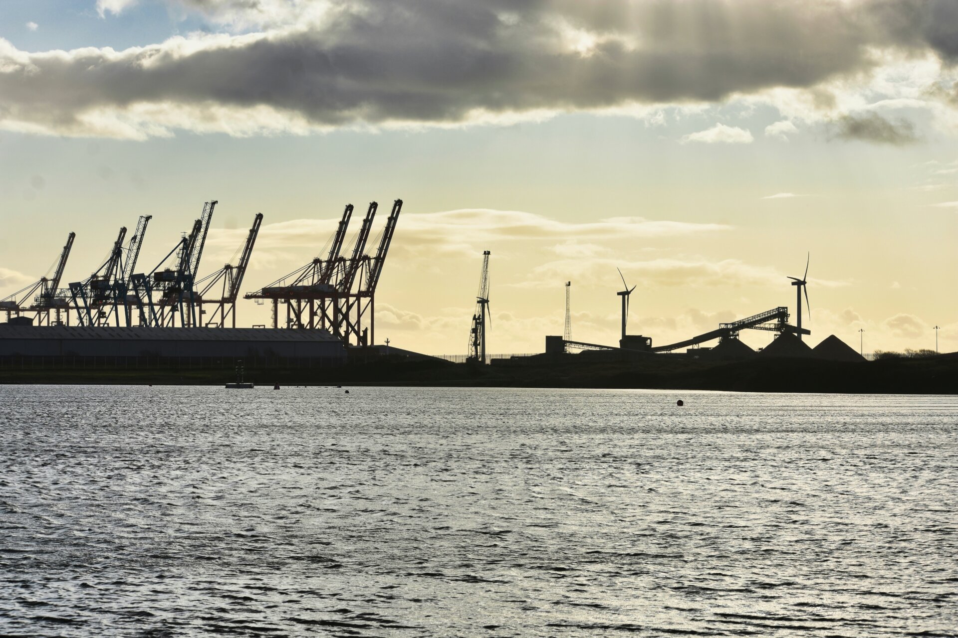 Industry and construction cranes at a port in Liverpool.