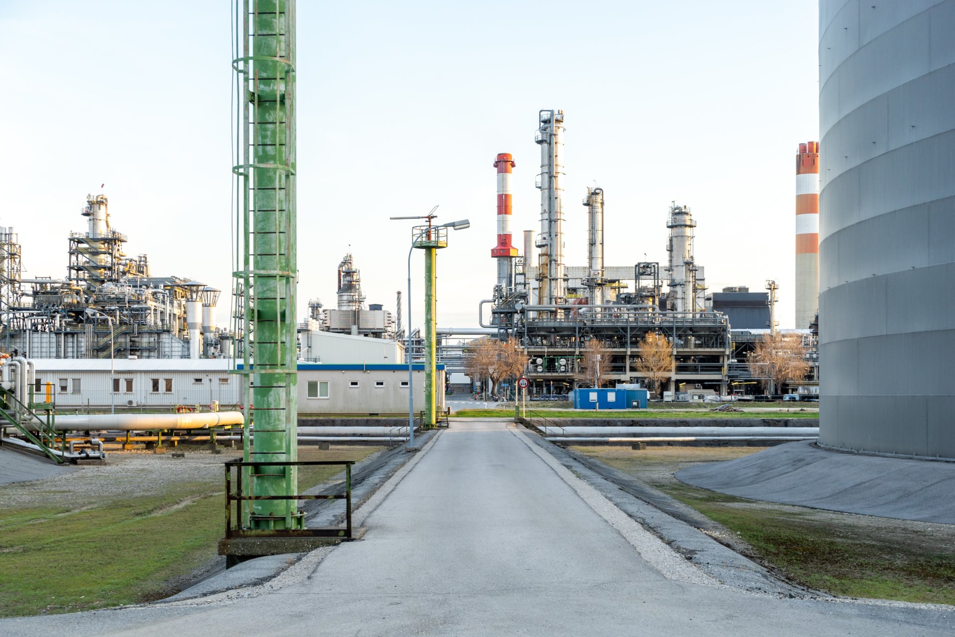 Oil refinery against pale blue sky
