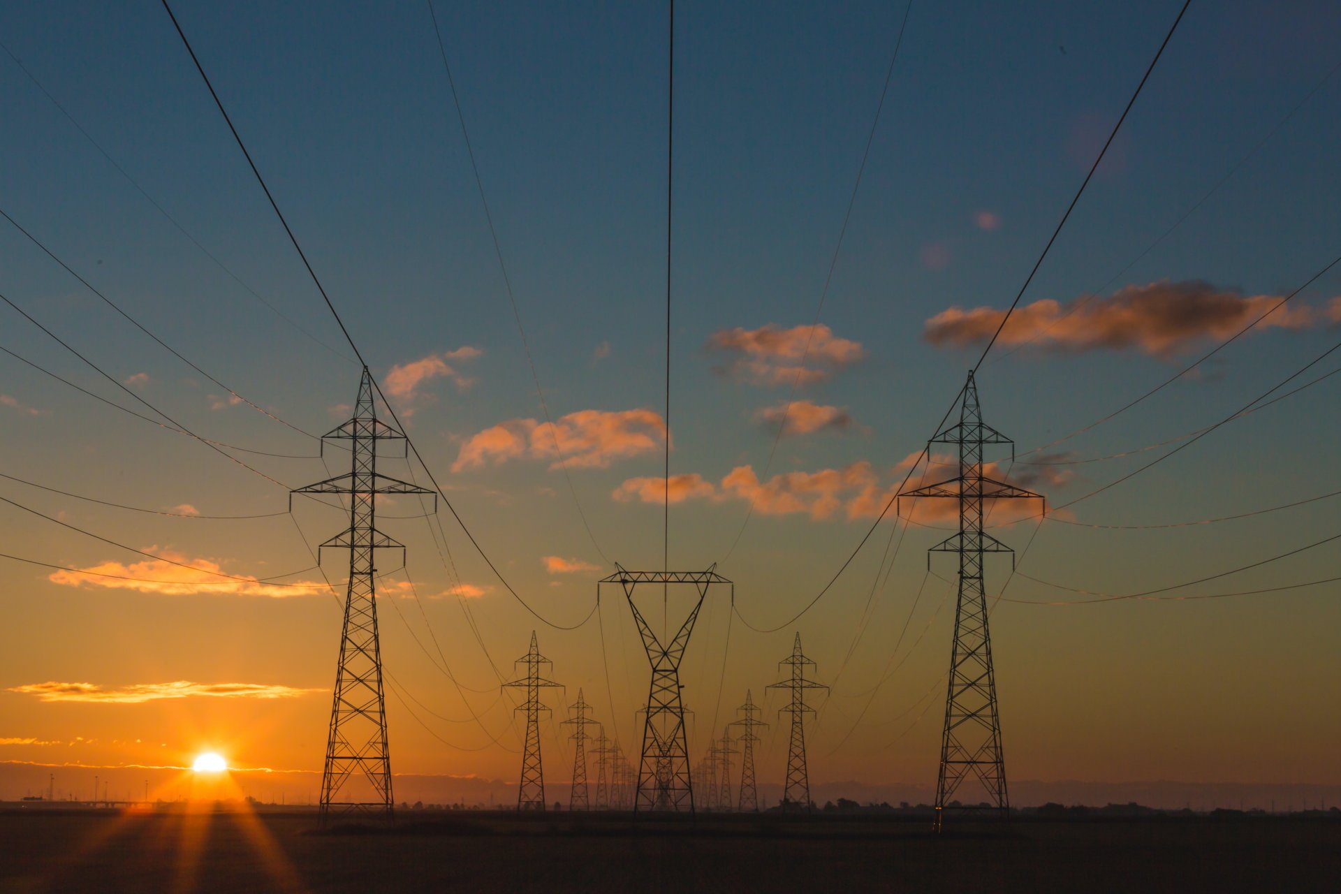 Electricity power pylons at sunset